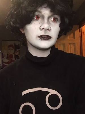 A post by @blackrosesmoothie on TikTok caption: shoutout to corvo who helped me through the dysphoria when we cosplayed #karkatvantas #homestuck #betatrolls #karkat