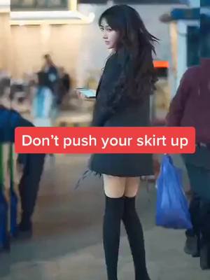 A post by @chinese_street_fashion on TikTok caption: Do you think her shirt is too short #beautiful #longlegs #fashion #StreetFashion #chinesestreetfashion #fyp #foryoupage