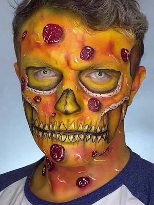 A post by @muatommy on TikTok caption: Reply to @evierock6349 Process of how I made pizza 🍕🍕 #processvideo #mua #creativemakeup #pizza #skullmakeup