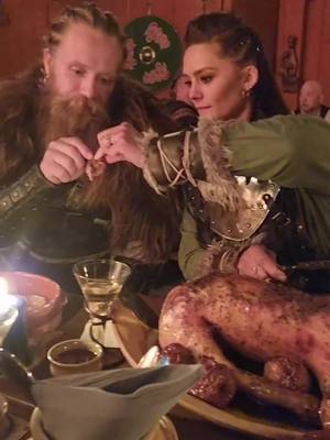 A post by @alexandraehernandez on TikTok caption: Real Viking feast 🍗🍷🐷🍻 @thorrosland @vikingvalley @thebeardstruggle #viking#shieldmaiden#shieldmaidens#vikings#thebeardstruggle#norge#norway#food