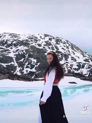 A post by @alexandraehernandez on TikTok caption: HAPPY BIRTHDAY NORWAY🇳🇴🏔 Constitution day in Norway! #norway#happybirthday#bunad#utpåtur#utpåturaldrisur#17mai2021#17mai#incredible#nature#norge