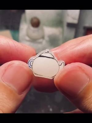 A post by @jigsawjewelry1 on TikTok caption: A carving smaller than a fingernail #carving