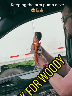 A post by @kaity0310 on TikTok caption: We keep the arm pump alive in this family 😎 #armpump #trucker #toystory #woody #DADMOVES #roadtrip