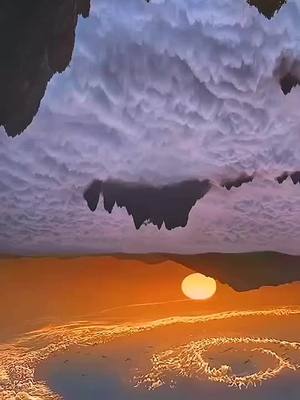 A post by @royyy865 on TikTok caption: Turn your phone upside down #sunset #cloud #incredible