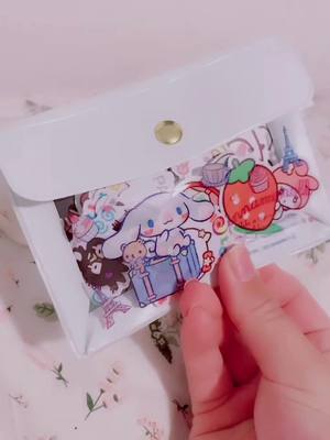 A post by @polkavona on TikTok caption: I got a tiny pouch finally for all my stickers I had in a drawer 💀😅 #cinnamoroll #sanrio #stickers #journalinspiration #kawaii #sanriocore