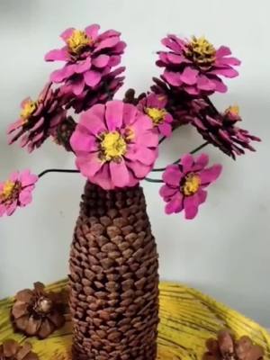 A post by @ on TikTok caption: Pine Tower Flower #pinetower#DIY #handmade #craft #tiktok #foryou #bottleinsert#