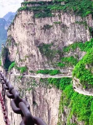 A post by @iamxj2019 on TikTok caption: #scenery #tiktoktrvel #cliffhighway #foryou #amazing