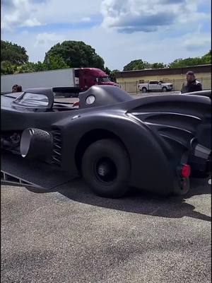 A post by @idealclassiccars on TikTok caption: After the widest parts have cleared the trailer, it's smooth sailing! #bat #batman #batmobile #hollywood #movie #michaelkeaton #fyp #fypシ #1989 #cars