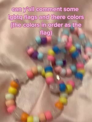 A post by @emo_kandi on TikTok caption: #bracelet #XfinityFanthem #lgbtq #ClearGenius #kandi