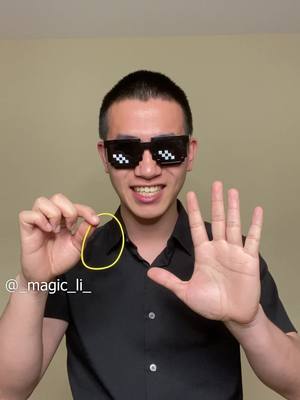 A post by @_magic_li_ on TikTok caption: Best rubber band trick! #wannalearnthistrick