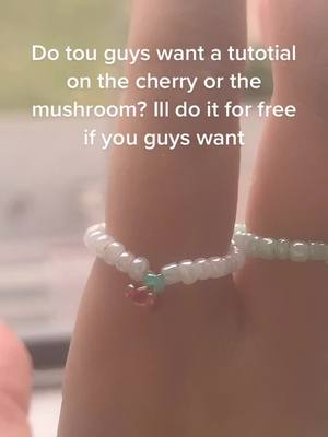 A post by @kidcore_...lady on TikTok caption: #ring #bead #tiny #cherryring #mushroomring #cute #tutorial #girl #awnser