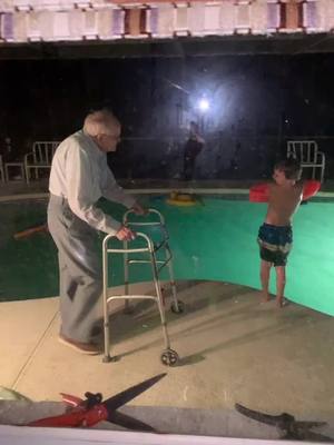 A post by @karencolbourne852 on TikTok caption: Great Grand father (90 yrs young) pushing Logan into the pool!!!😂🤣😂