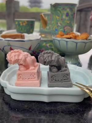 A post by @yummystar on TikTok caption: Lazy sleepy Chinese guardian lions 🦁 😂 #dessert #funnymoments #chinesefood #chinesedessert #afternoontea #FoodLover #guardianlion