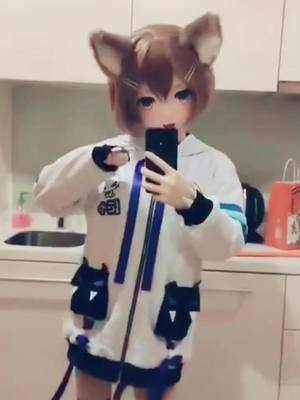 A post by @kigwaifu on TikTok caption: Thank you for nice comments, nya~ #animegao #kigurumi #mask #cosplay #cosplaygirl #cute #kawaii #scary #creepy #wig #fypシ #anime #manga #dancing #weeb