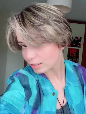 A post by @mochatea.cos on TikTok caption: My hair finally changed again #nonbinary #theythem #hairbleach