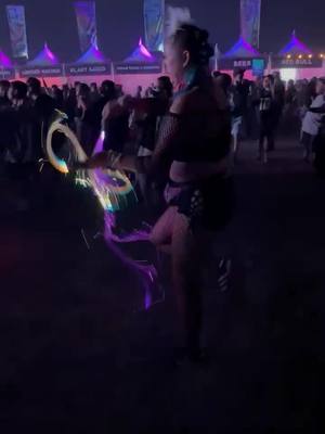 A post by @mikayla_edan on TikTok caption: just me vibin' at #nocturnalwonderland2021