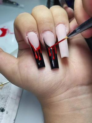 A post by @nailsbyymoni on TikTok caption: 🩸 #fyp #halloweennails #nailvideos #nails #nailtutorial #nailinspo