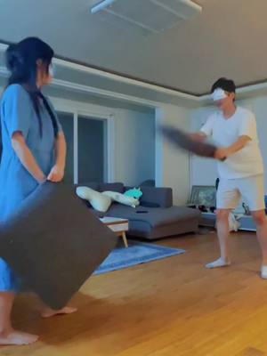 A post by @erica7330 on TikTok caption: 게임에 진심인 편 Pillow fight with my wife😵 #찐한부부 #fypageシ #marriagelife #Funny #Korean #추천