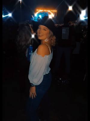 A post by @jessis628 on TikTok caption: Name a better time than singing Neon Moon with a huge crowd of people with the OG cowboys themselves. #neonmoon #brooksanddunn #budlight #bucketlist