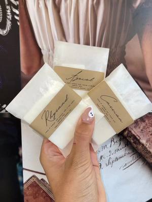 A post by @wickedvibescandleco on TikTok caption: pause to read scent notes. giving a few samples out with each order placed TODAY. These are NOT the official labels. #ACOTAR #rhysand #cassian #azriel