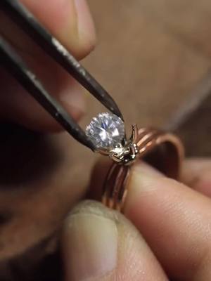 A post by @jigsawjewelry1 on TikTok caption: Diamond setting process. #craft #diamond #beauty