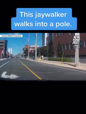 A post by @eliteninja00 on TikTok caption: This jaywalker walks into a pole.