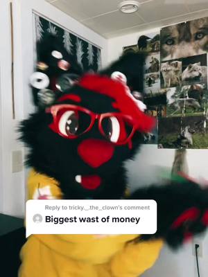 A post by @octoberwolf_98 on TikTok caption: Reply to @tricky._.the_clown  It’s my money that I worked for, I do what I want with it! 😌💵 #furry #furryfandom #fursuiter #nobodyasked #foryou #foryoupage #fyp