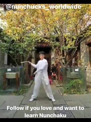 A post by @nunchucku_worldwide on TikTok caption: Follow if you want to learn #nunchaku #nunchakus #nunchucku #martialarts #shaolin #kungfu #wingchun #wushu #karate #blackbelt #dojo #mma