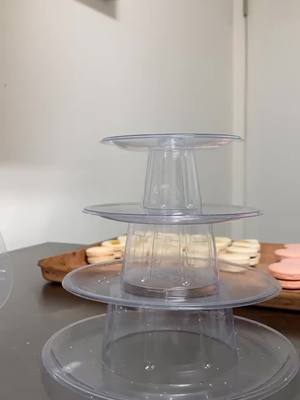 A post by @macaretto_ on TikTok caption: Make a macaron tower with me #viral #fyp #baking #macarons #tower #sweets #sugar