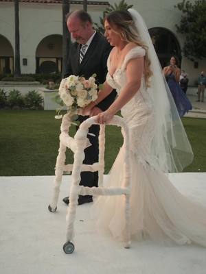 A post by @thefilmpoets on TikTok caption: She’s always dreamed of walking down the aisle for her wedding. #weddingtiktok #wedding #wheelchair