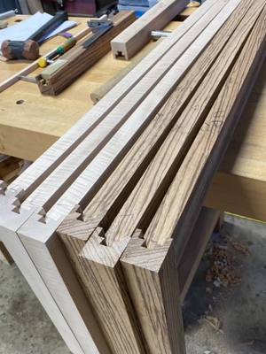 A post by @designedwithpurpose on TikTok caption: How I make round legs with dovetail joinery  #designedwithpurpose