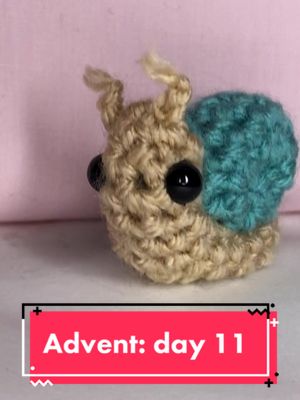 A post by @annasfrogkingdom on TikTok caption: Day 11: snail 🐌 Come back tomorrow for day 12!                    pc:TheWanderingDeer #crochetok #crochetadvent #crochet #fyp