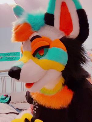 A post by @starpupstudio on TikTok caption: New suit who this 👀💛💙🧡 her name is Calypso! (This sound was too funny not to use lol) #fursuit #furryfandom #fursuiter