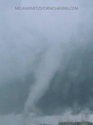 A post by @melaniemetzstormchasing on TikTok caption: Multiple #TORNADOES emerging from the rain! One of my chases in #Iowa. #weather #storm