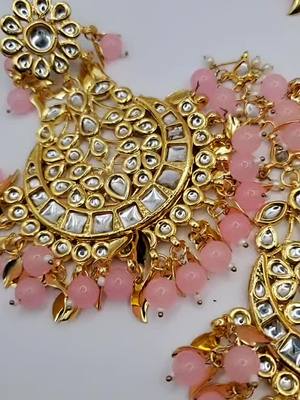 A post by @jewellerycafecanada on TikTok caption: OVERSIZED EARINGS TIKKA #meenakarijewellery #jewellerylover #jewelrybusiness #SmallBusiness #jewelrysale #kundanjewellery #jewelry