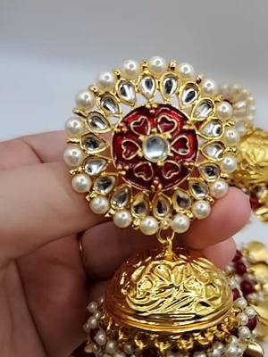 A post by @jewellerycafecanada on TikTok caption: OVERSIZED JHUMKI TIKKA #jewelry #kundanjewellery #jewelrysale #SmallBusiness #jewelrybusiness #jewellerylover #meenakarijewellery #tiktokcanada