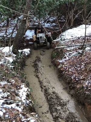 A post by @bedestructive on TikTok caption: Little mud hole to nowhere at Bares trails today!  #sears #tractor #mudmower #mud #Outdoors #snow #dwight #sendit #wheelie #yeet #nc #offroad