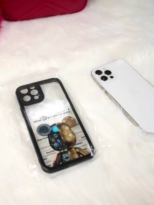 A post by @couplephonecase on TikTok caption: Unboxing a new bearbrick phone case! #phonecase #phonecover #phoneprotector #foryou #fyp #bearbrick