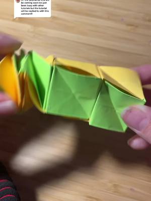 A post by @.0rigam1 on TikTok caption: Reply to @.0rigam1  sorry this took so long but here it is!! #origami #glue #foryoupage #viralpls #origami #postitnotes #orange #green #tut #tutorial