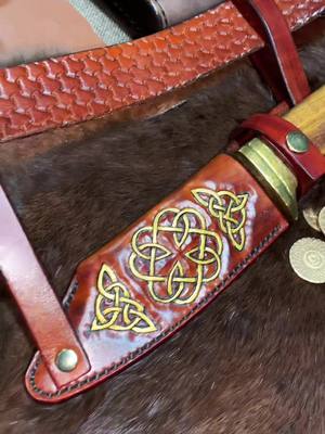 A post by @luke_leathercrafting on TikTok caption: I'm back! Hopefully will be posting a bit more regularly. #leatherwork #leathercraft #sheathmaking #celticknot #knifesheath #leathersmith