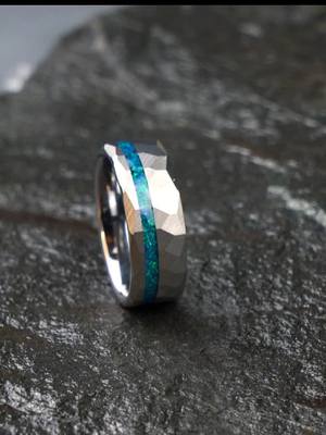 A post by @lanfengleefee on TikTok caption: #rings #opal #jewelrybusiness #mensrings #mensband #meteorites #damascussteel #handmade #fouryou