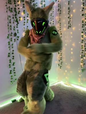 A post by @viridianprotogen on TikTok caption: how are my dance moves >w< #furry #fursuit #protogen