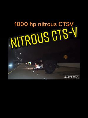 A post by @ccracingg on TikTok caption: Pulling chutes on the highway?? 🧐 Via:street car video YT #racing #dragracing #nitrous #v8 #rollracing #car #fyp