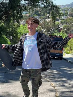 A post by @lucasdewdvlogs on TikTok caption: i skated the tesla hill jump hill! 👀🛹 this spot was so steep but fun to do powerslides. much love 🦋 #Skateboarding #teslajump #skater #california #skaterboy