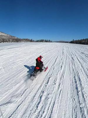 A post by @upstatesledders on TikTok caption: Missing blue bird days on the lake! Soon the ice will be gone and the boats will be out❄️ #upstateny #upstatesledders #snowmobile #skidoo #polaris #wheelies #oldforge #fingerlakes