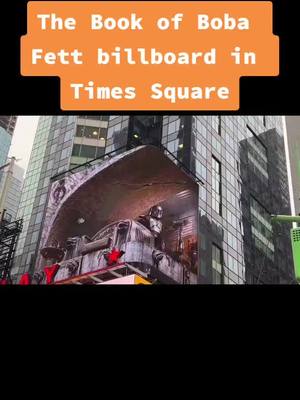 A post by @geeksgonnageek on TikTok caption: The Book of Boba Fett billboard in Times Square 😲 #starwars #themandalorian #thebookofbobafett #bobafett