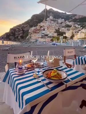 A post by @thefirstluxuryclub on TikTok caption: Lunch goals at Positano beach 😍 Positano is a cliffside village on southern Italy's Amalfi Coast. It's a well-known holiday destination with a pebble beachfront and steep, narrow streets lined with beautiful boutiques and cafes. ✨Is Positano on your 2022 bucket list? 😍#italy #amalficoast #explore #holiday #vacation #romantic #lif#Lifestylexury