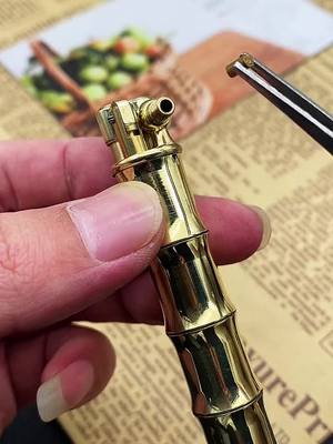 A post by @craftsman5180 on TikTok caption: Bamboo brass hand lighter#foryou #lighter #lighterlover