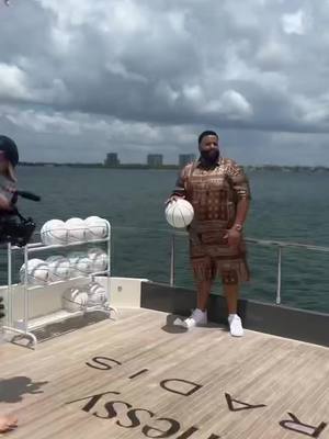 A post by @thefirstluxuryclub on TikTok caption: @djkhaled slam dunking on a yacht 😅#thefirstluxuryclub