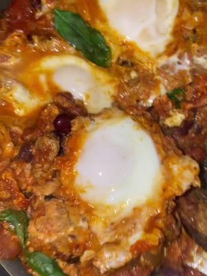 A post by @stayingalive365 on TikTok caption: This is your sign to make #shakshuka with leftover chili. Like immediately. #cooking #foryou